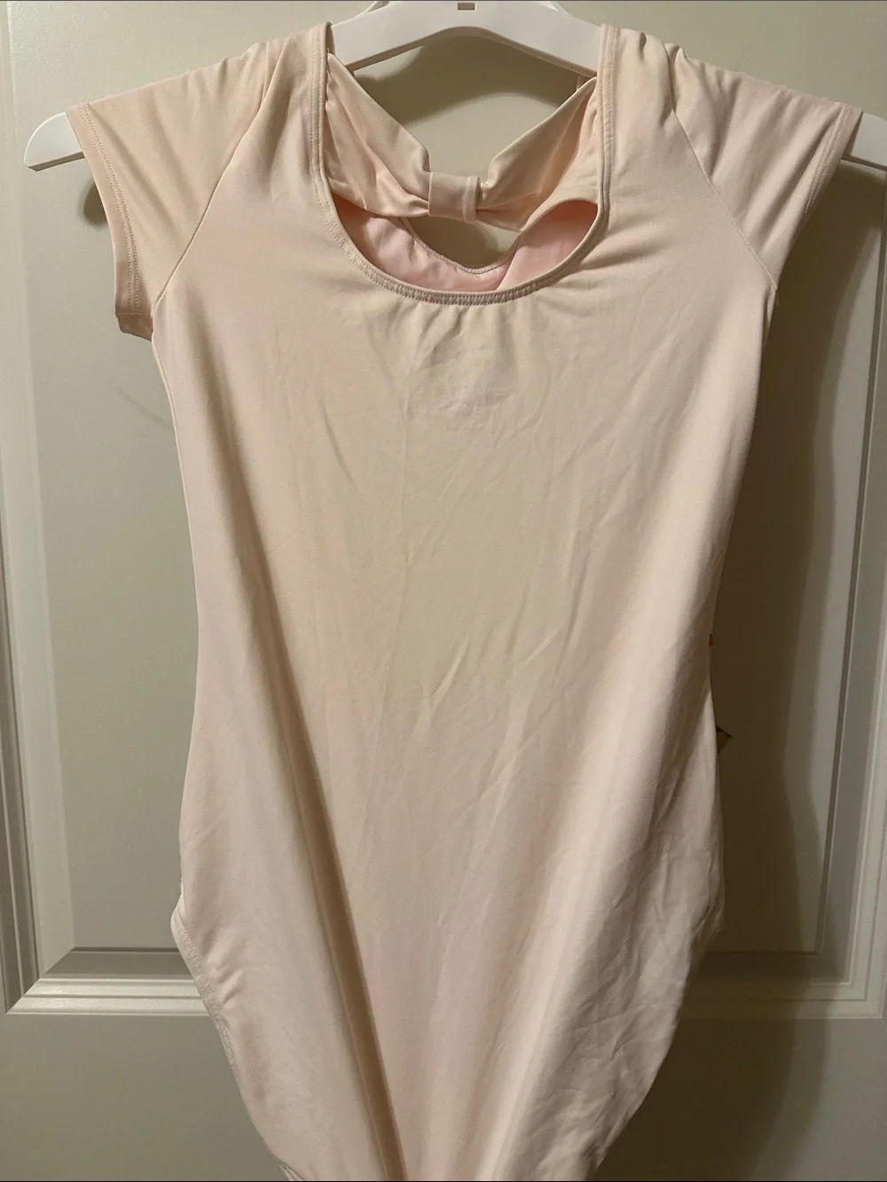 Justice Girls Short Sleeve One-Piece Bodysuit in Pale Pink